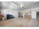 Spacious two-car garage with ample storage, including built-in cabinets and room for organization at 1612 Fairway Oaks Dr, Palmetto, FL 34221