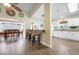 Bright living space showcasing bar seating, views of the kitchen, and an adjacent dining area at 1612 Fairway Oaks Dr, Palmetto, FL 34221