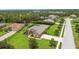 Aerial view of a home featuring lush landscaping and a screened in lanai at 16246 26Th E St, Parrish, FL 34219