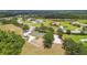 An aerial view of a community park with lush landscaping, picnic areas, and recreational courts at 16246 26Th E St, Parrish, FL 34219