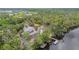 A house sits secluded within the woods at the end of a river at 16246 26Th E St, Parrish, FL 34219