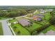 A nicely landscaped yard features a screened lanai with a pool at 16246 26Th E St, Parrish, FL 34219