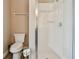 Clean bathroom with a walk-in shower, tile flooring, and a modern toilet at 16246 26Th E St, Parrish, FL 34219