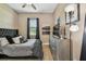 Comfortable bedroom featuring dark accents and furniture, plus natural light from the window at 16246 26Th E St, Parrish, FL 34219