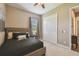 Comfortable bedroom features neutral decor, a ceiling fan, and a window with natural light at 16246 26Th E St, Parrish, FL 34219