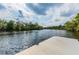 A concrete boat launch and a wooden dock on a body of water at 16246 26Th E St, Parrish, FL 34219
