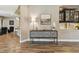 Open hallway with wood-look flooring, and stylish buffet with decor at 16246 26Th E St, Parrish, FL 34219