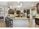Kitchen with granite countertops, stainless appliances, bar stool seating, and pendant lighting at 16246 26Th E St, Parrish, FL 34219