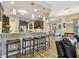 Kitchen with granite countertops, bar stool seating, stainless appliances, and pendant lighting at 16246 26Th E St, Parrish, FL 34219