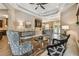 Open living room featuring wood-look tile, tray ceiling, stylish decor, and furniture arrangement at 16246 26Th E St, Parrish, FL 34219