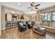 Open-concept living space with tile flooring, comfortable seating, and kitchen views at 16246 26Th E St, Parrish, FL 34219