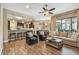 Open-concept living space with tile flooring, comfortable seating, and kitchen views at 16246 26Th E St, Parrish, FL 34219