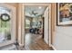 View of an office with wood-look tile floors, large windows, and custom decor at 16246 26Th E St, Parrish, FL 34219