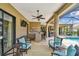 Entertain in style with a screened patio, wet bar, ceiling fan, and views of the swimming pool at 16246 26Th E St, Parrish, FL 34219
