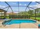 Screened-in pool and patio area with lounge chairs at 16246 26Th E St, Parrish, FL 34219