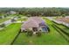 A screened lanai and pool area can be enjoyed in this beautifully landscaped backyard at 16246 26Th E St, Parrish, FL 34219