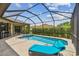 Screened-in pool and patio area with lounge chairs at 16246 26Th E St, Parrish, FL 34219
