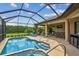 Screened-in pool and patio area with lounge chairs and an outdoor bar at 16246 26Th E St, Parrish, FL 34219