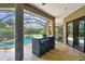 Outdoor space featuring covered patio, outdoor bar, pool and spa at 16246 26Th E St, Parrish, FL 34219