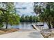 A concrete boat ramp and wooden dock gives access to the river at 16246 26Th E St, Parrish, FL 34219