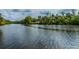 An open view down the river towards the horizon with lush tree growth on either side at 16246 26Th E St, Parrish, FL 34219