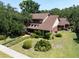 Beautiful home with lush landscaping and a well-manicured lawn at 1671 South Dr, Sarasota, FL 34239