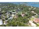 Aerial view of the home and neighborhood with an overlay circle, identifying the street names and lush green trees at 1671 South Dr, Sarasota, FL 34239