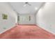 Spacious bedroom featuring bright natural light and a ceiling fan at 1671 South Dr, Sarasota, FL 34239