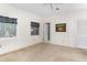 Bright bedroom with a window, neutral walls, and a convenient entrance to another room at 1671 South Dr, Sarasota, FL 34239