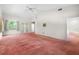 Large bedroom with vaulted ceilings, fan and French doors at 1671 South Dr, Sarasota, FL 34239