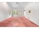 Large bedroom with vaulted ceilings, fan and lots of windows at 1671 South Dr, Sarasota, FL 34239