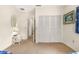 Bedroom featuring twin beds, a closet, and a door to another room at 1671 South Dr, Sarasota, FL 34239