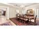 Spacious dining room featuring a large wooden table and chairs with ornate decor at 1671 South Dr, Sarasota, FL 34239
