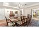 Formal dining room with a large table, chandelier, and classic decor details at 1671 South Dr, Sarasota, FL 34239
