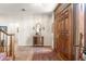 Cozy entryway with tile flooring and dark wood front door at 1671 South Dr, Sarasota, FL 34239