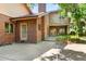 Brick exterior with a balcony and French doors leading to the backyard patio at 1671 South Dr, Sarasota, FL 34239