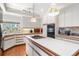Open concept kitchen with island, breakfast bar, decorative tile backsplash and modern appliances at 1671 South Dr, Sarasota, FL 34239