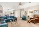 Spacious living room with ample seating, natural light, and seamless connection to the kitchen area at 1671 South Dr, Sarasota, FL 34239