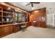 Home office featuring custom built-ins, ample storage, and natural light from the window at 1671 South Dr, Sarasota, FL 34239
