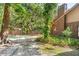 Backyard pool with brick exterior and lush landscaping creates a relaxing backyard retreat at 1671 South Dr, Sarasota, FL 34239