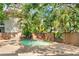 Secluded community pool surrounded by lush greenery, offering a private oasis for relaxation and recreation at 1671 South Dr, Sarasota, FL 34239