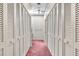 Large walk-in closet with storage and ceiling fan at 1671 South Dr, Sarasota, FL 34239