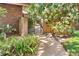 Landscaped walkway with brick accents leading to a charming garden gate at 1671 South Dr, Sarasota, FL 34239