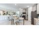 Modern kitchen with stainless steel appliances, granite countertops, and ample cabinet space at 18052 Cropside Trl, Lakewood Ranch, FL 34211