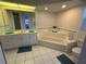 Bathroom features a raised garden tub, double sinks, and large vanity for a spa-like experience at 21498 Beaverton Ave, Port Charlotte, FL 33952