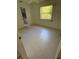 Bright, empty bedroom with tile flooring, a window, and a closet space to create a personalized retreat at 21498 Beaverton Ave, Port Charlotte, FL 33952