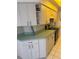 The kitchen features ample cabinet storage, an electric range, and neutral countertops, ready for your culinary touch at 21498 Beaverton Ave, Port Charlotte, FL 33952