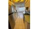 Spacious kitchen with tile flooring, ample cabinets, and modern appliances, with an adjacent dining area at 21498 Beaverton Ave, Port Charlotte, FL 33952