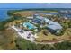 Aerial shot showcases amazing amenities, including a pool, beach area, and beautiful landscaping at 262 Sapphire Lake Dr # 202, Bradenton, FL 34209