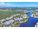 Expansive aerial view showcasing a beautiful community with lush surroundings near a pristine lake at 262 Sapphire Lake Dr # 202, Bradenton, FL 34209
